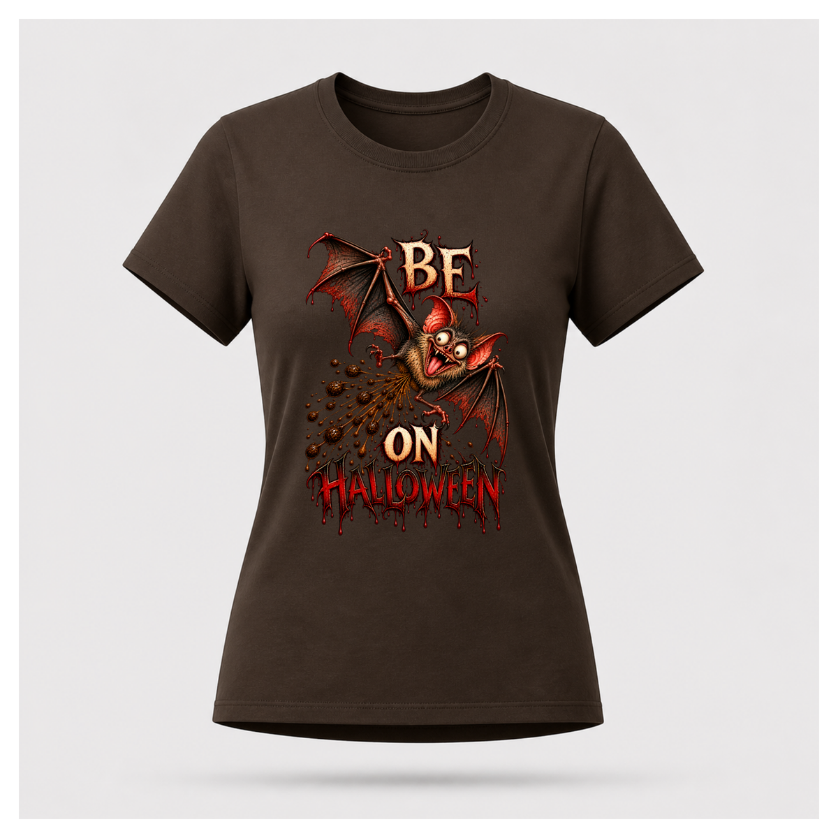 Dark chocolate brown Batshit Crazy Halloween T-shirt on a female-form floating tee, featuring a manic bat graphic with BE, ON HALLOWEEN and red distressed details.