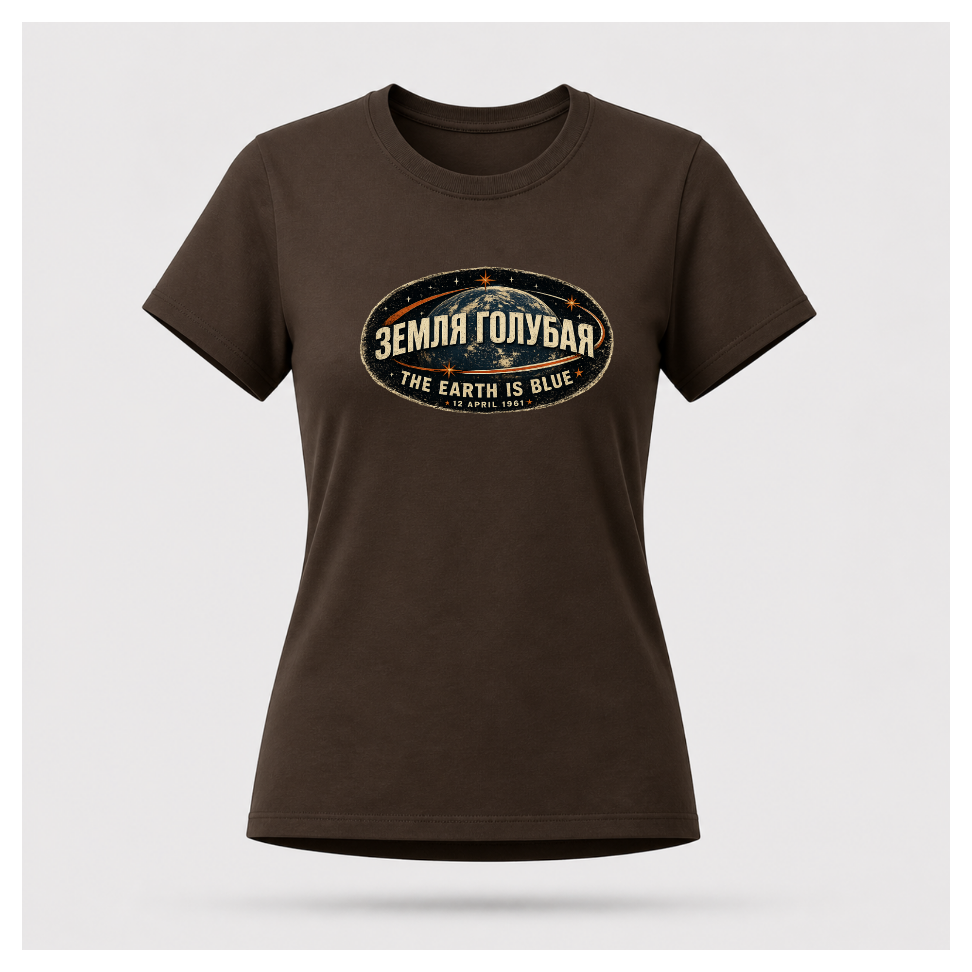 Front of a floating chocolate brown female-form Gildan 5000 T-shirt featuring the The Earth Is Blue design with the Russian phrase "ЗЕМЛЯ ГОЛУБАЯ" above Earth and the English translation below.  by RIOTTEES