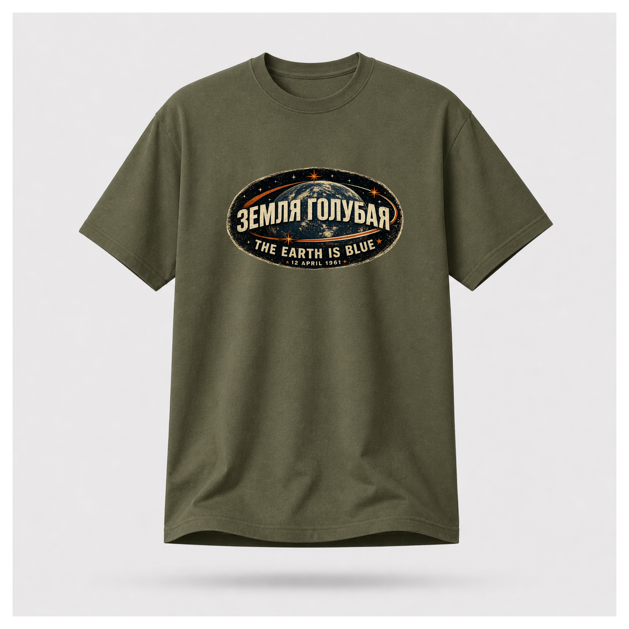 Front of a floating military green male-form Gildan 5000 T-shirt featuring the The Earth Is Blue design with the Russian phrase "ЗЕМЛЯ ГОЛУБАЯ" above Earth and the English translation below. by RIOTTEES