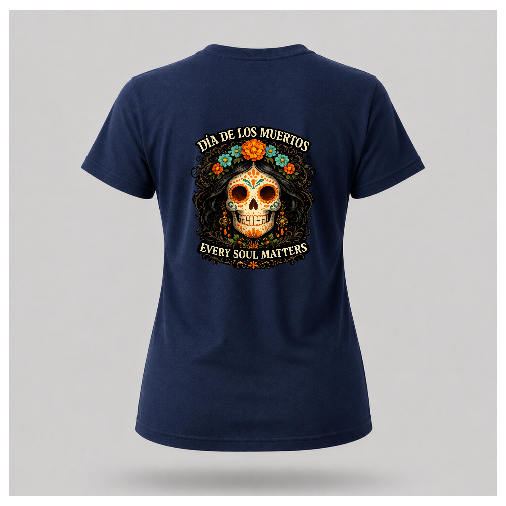 Floating navy blue Every Soul Matters – Día de los Muertos t-shirt by RIOTTEES in a feminine tee shape with the large sugar skull artwork printed on the back.