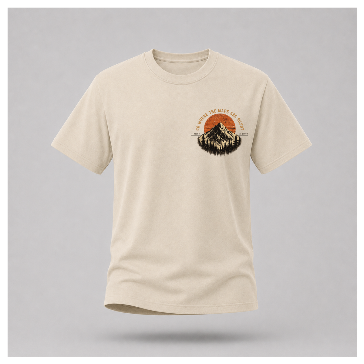 Sand male form floating tee, front view, featuring the small Go Where The Maps Are Silent mountain design and text on the chest by RIOTTEES.
