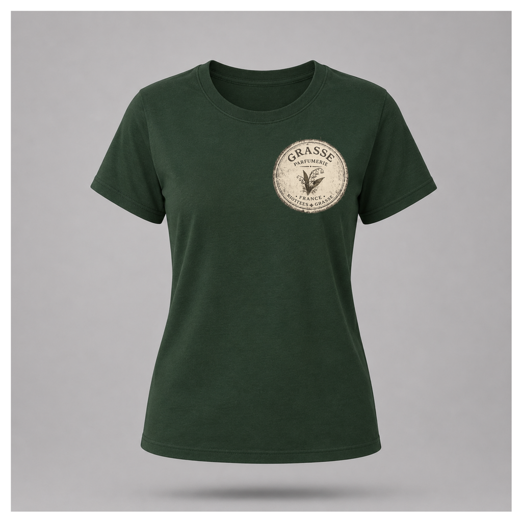 Forest green Grasse Parfum Apothecary T-shirt on a floating female form, featuring the small vintage apothecary emblem front design by RIOTTEES.