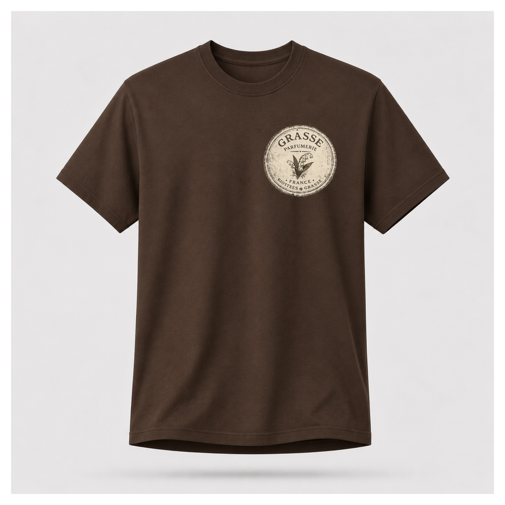 Chocolate brown Grasse Parfum Apothecary T-shirt on a floating male form, featuring the small vintage apothecary emblem front design by RIOTTEES.