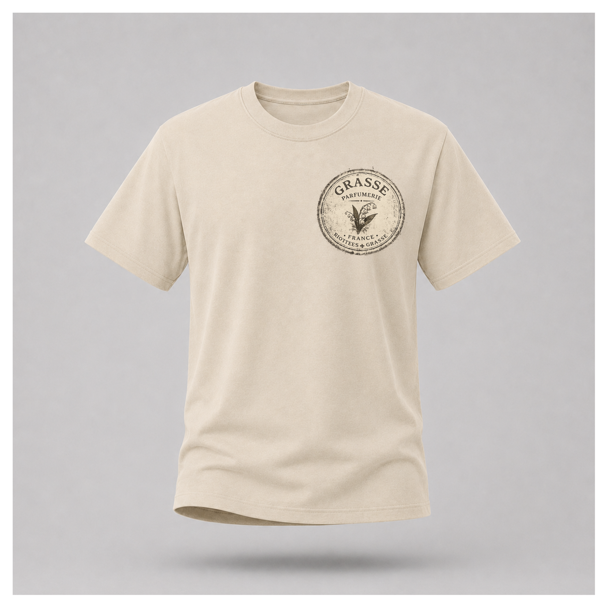 Sand Grasse Parfum Apothecary T-shirt on a floating male form, featuring the small vintage apothecary emblem front design by RIOTTEES.