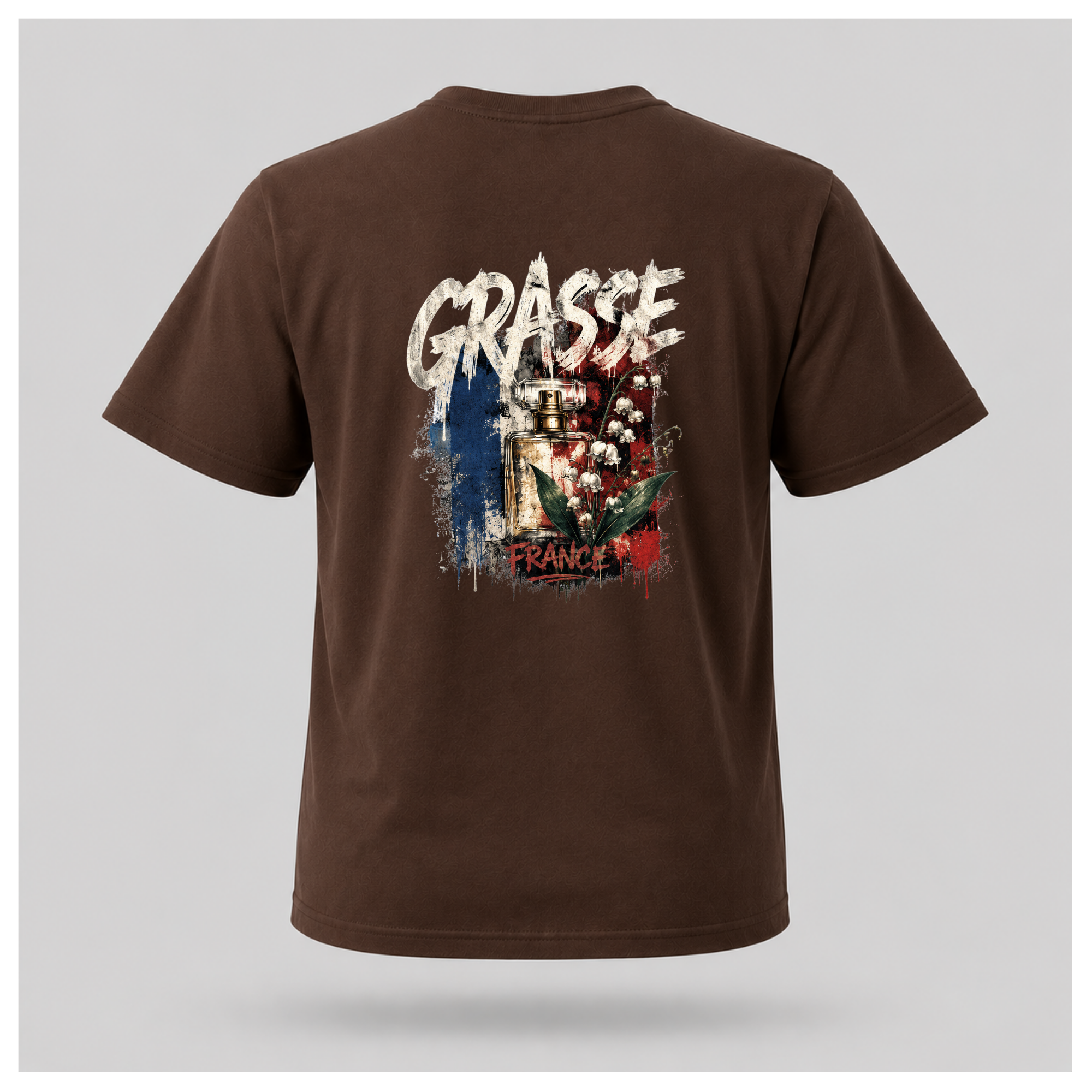 Floating male form wearing the Chocolate Brown Gildan 5000 Grasse Street Code T-shirt showing the BACK design featuring distressed Grasse typography, vintage perfume bottle and lily of the valley artwork inspired by the fragrance capital of France by RIOTTEES.
