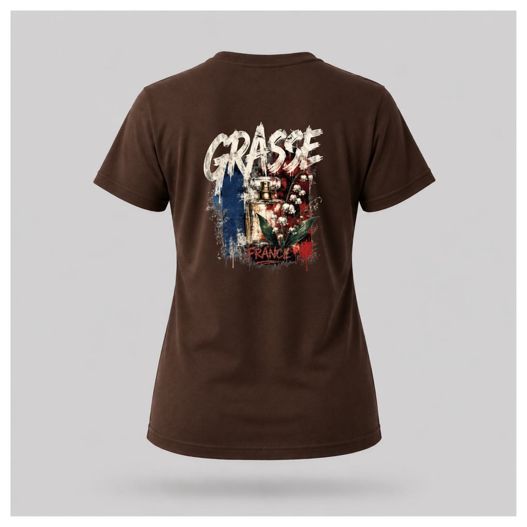 Floating female form wearing the Chocolate Brown Gildan 5000 Grasse Street Code T-shirt showing the BACK design featuring distressed Grasse typography, vintage perfume bottle and lily of the valley artwork inspired by the fragrance capital of France by RIOTTEES.