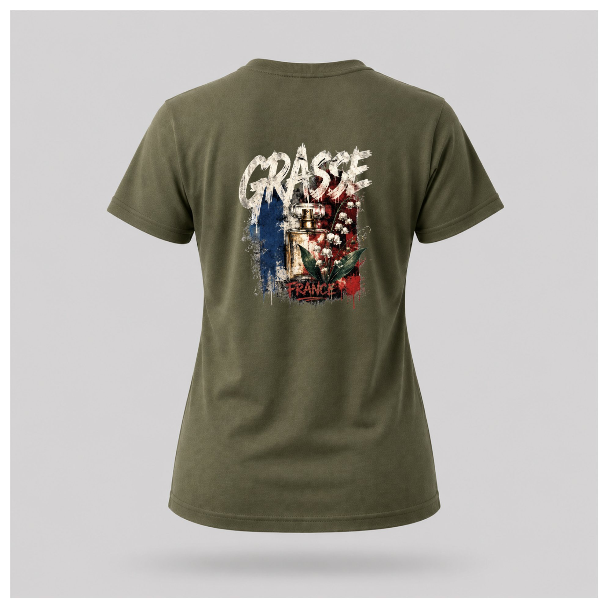 Floating female form wearing the Military Green Gildan 5000 Grasse Street Code T-shirt showing the BACK design featuring distressed Grasse typography, vintage perfume bottle and lily of the valley artwork inspired by the fragrance capital of France by RIOTTEES.