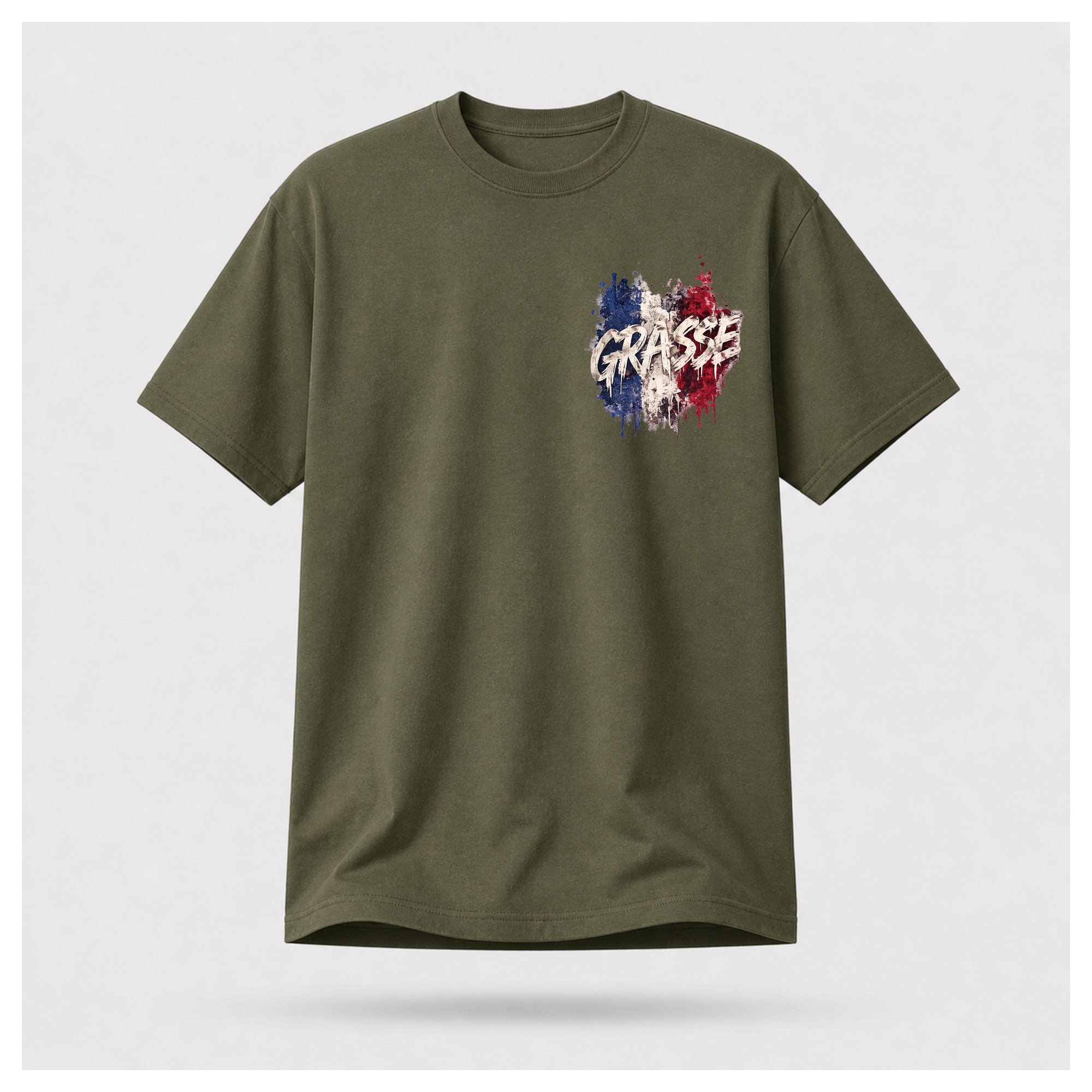 Floating male form wearing the Military Green Gildan 5000 Grasse Street Code T-shirt showing the FRONT with the Grasse pocket print inspired by the fragrance capital of France by RIOTTEES.