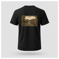 Black male form floating tee displaying the back design featuring an illustrated Islay landscape with lighthouse, distillery, Celtic cross, chapel, weaving mill and river on a Gildan 5000 T-shirt by RIOTTEES