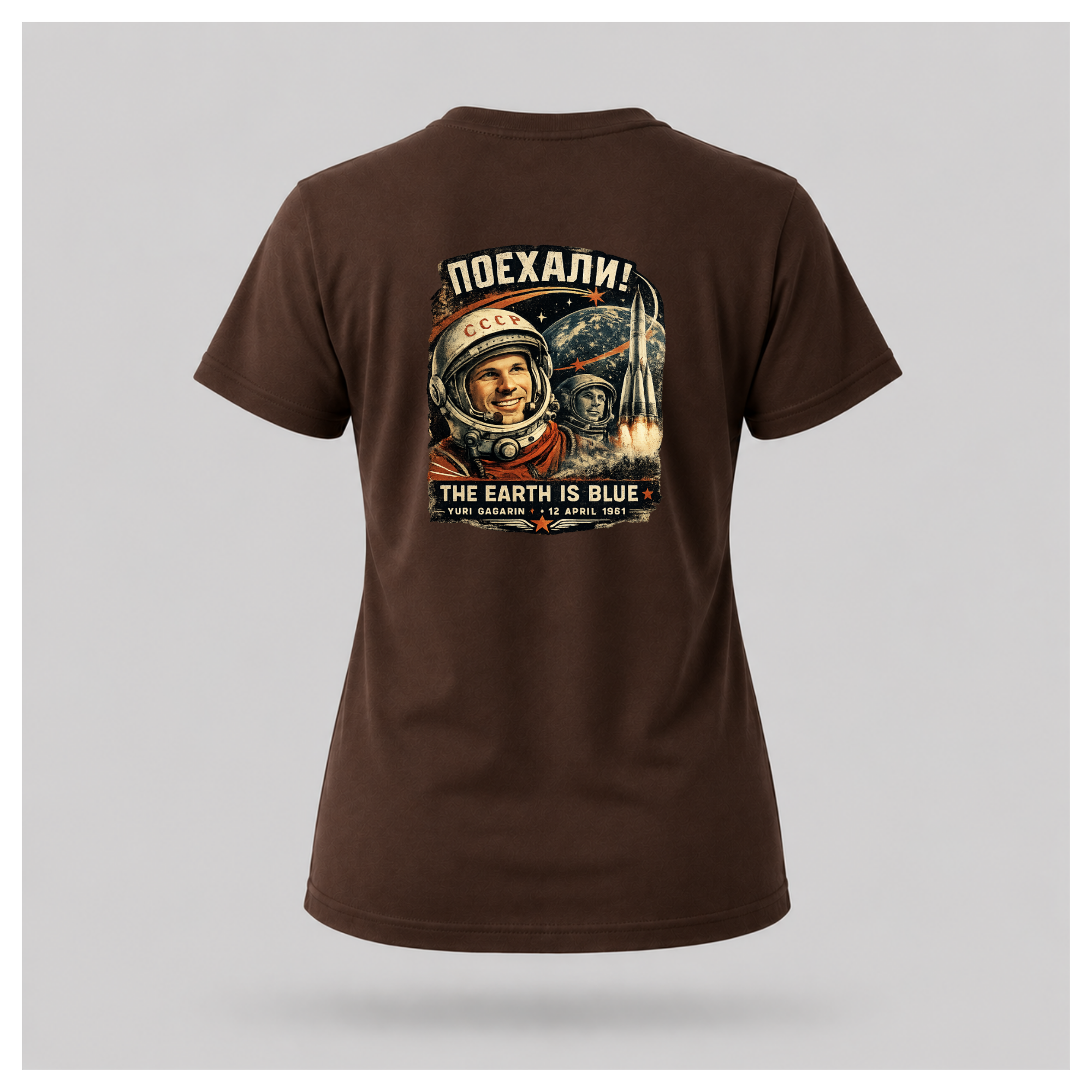 Back of a floating chocolate brown female-form Gildan 5000 T-shirt featuring the The Earth Is Blue Yuri Gagarin design celebrating the first human spaceflight. by RIOTTEES