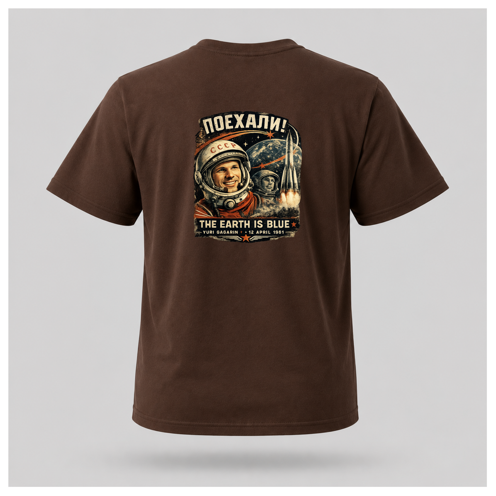 Chocolate Brown Let's Go! Yuri Gagarin T-shirt back displayed on a floating male-shaped figure, featuring the full vintage-inspired space exploration design by RIOTTEES.