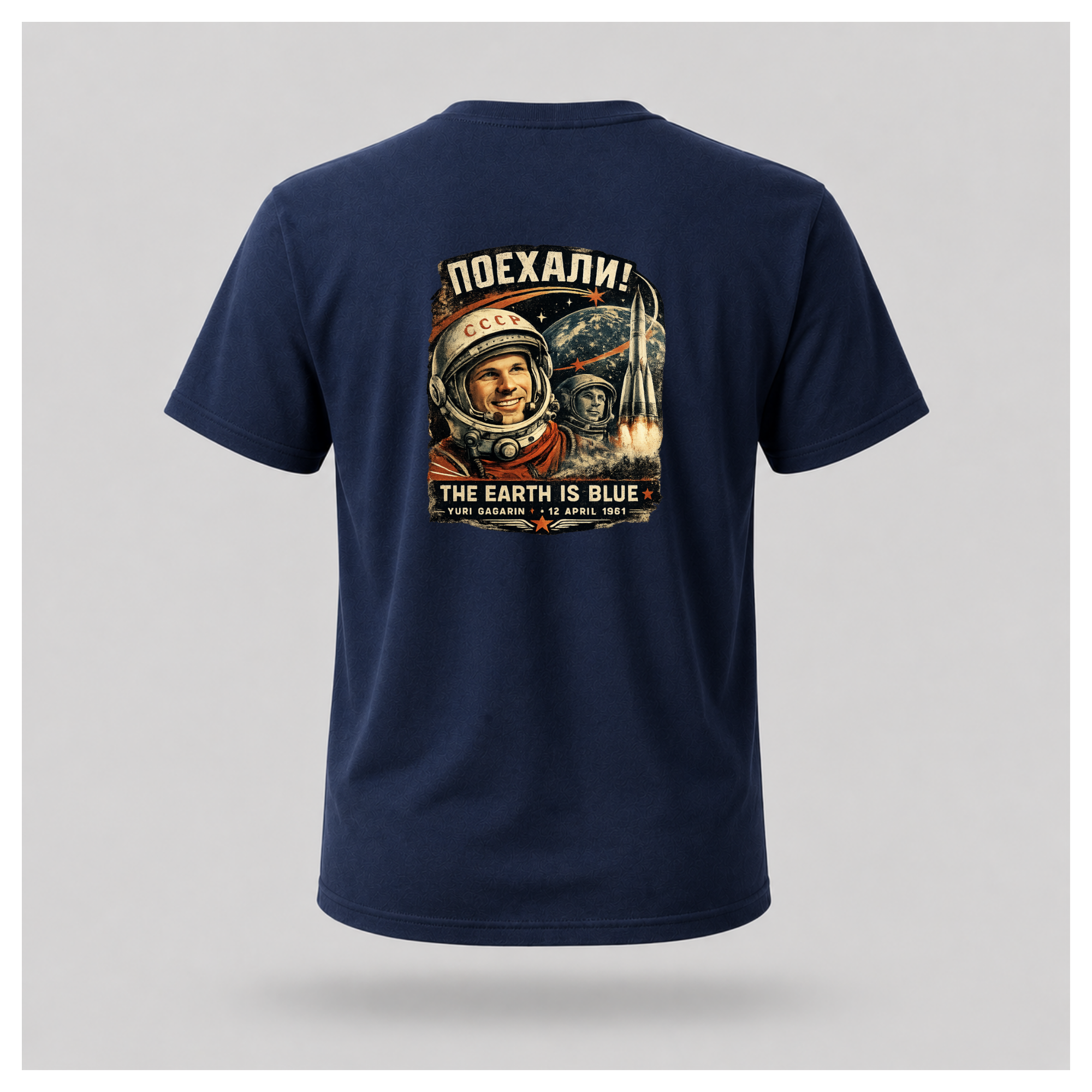 Navy Blue Let's Go! Yuri Gagarin T-shirt back displayed on a floating male-shaped figure, featuring the full vintage-inspired space exploration design by RIOTTEES.