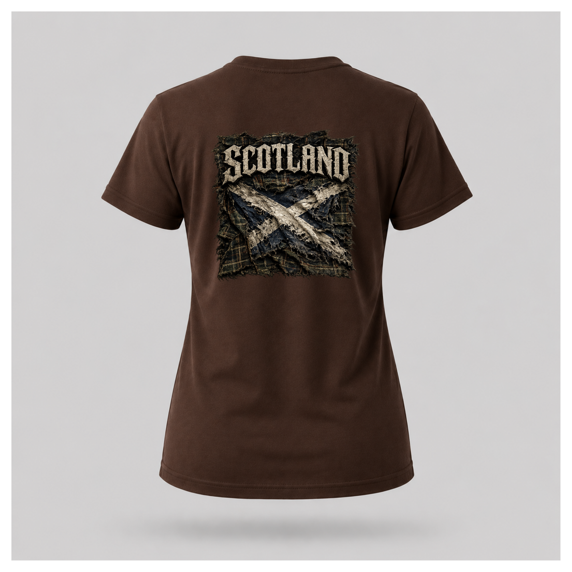 Female model wearing a chocolate brown Gildan 5000 t-shirt featuring the Modern Scotland design on the back with distressed Scotland lettering and weathered Saltire artwork, by RIOTTEES.