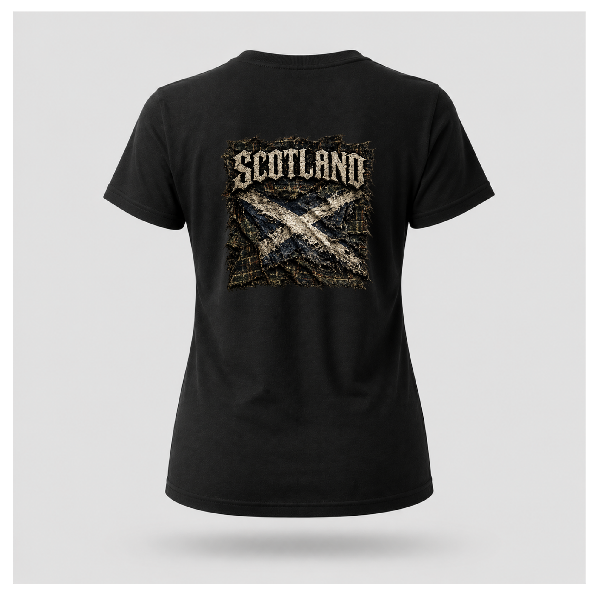 Female model wearing a black Gildan 5000 t-shirt featuring the Modern Scotland design on the back with distressed Scotland lettering and weathered Saltire artwork, by RIOTTEES.
