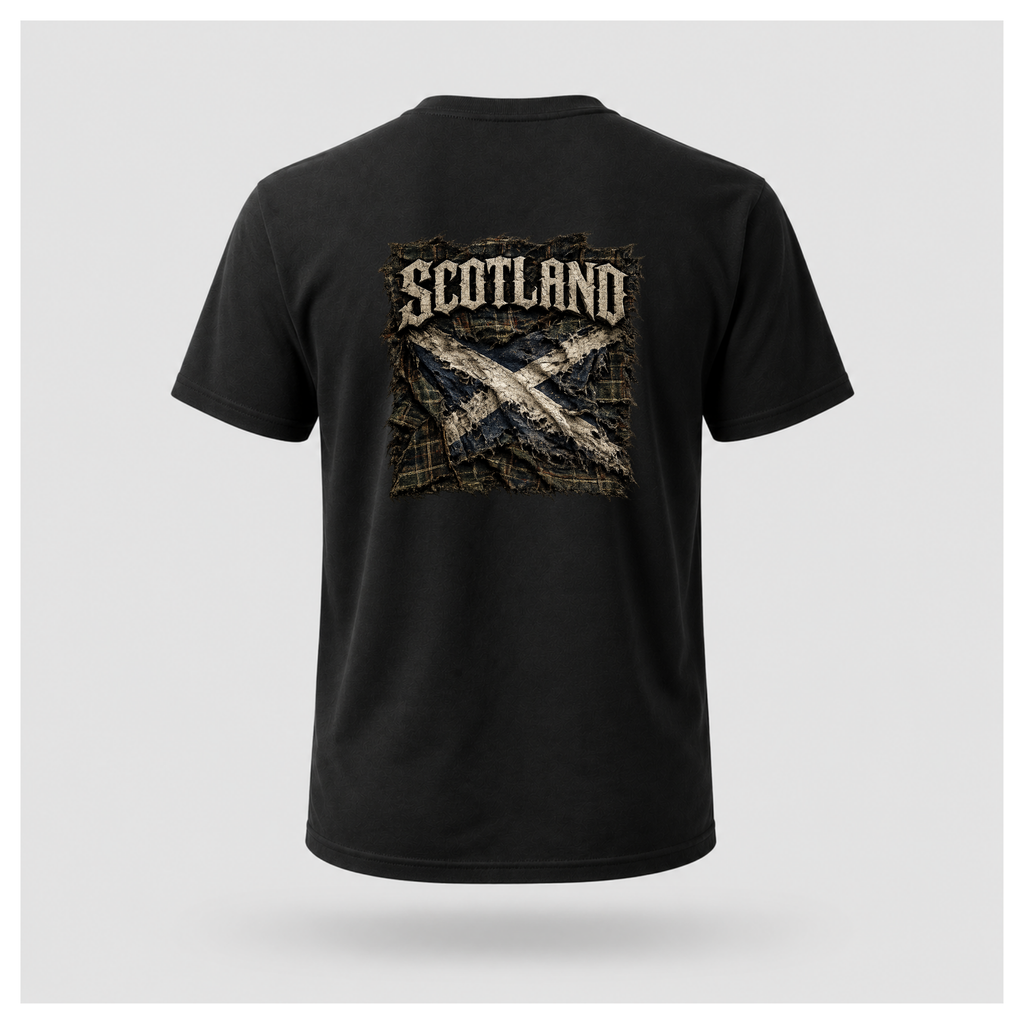 Male model wearing a black Gildan 5000 t-shirt featuring the Modern Scotland design on the back, displaying distressed Scotland lettering above a weathered Saltire layered over tartan, by RIOTTEES.