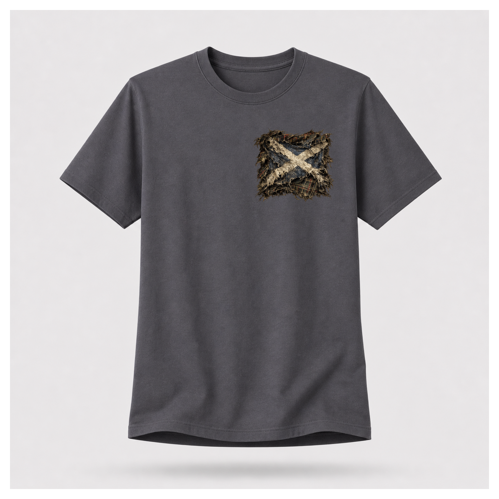 Male model wearing a charcoal grey Gildan 5000 t-shirt featuring the Modern Scotland small distressed Saltire emblem on the left chest, by RIOTTEES.