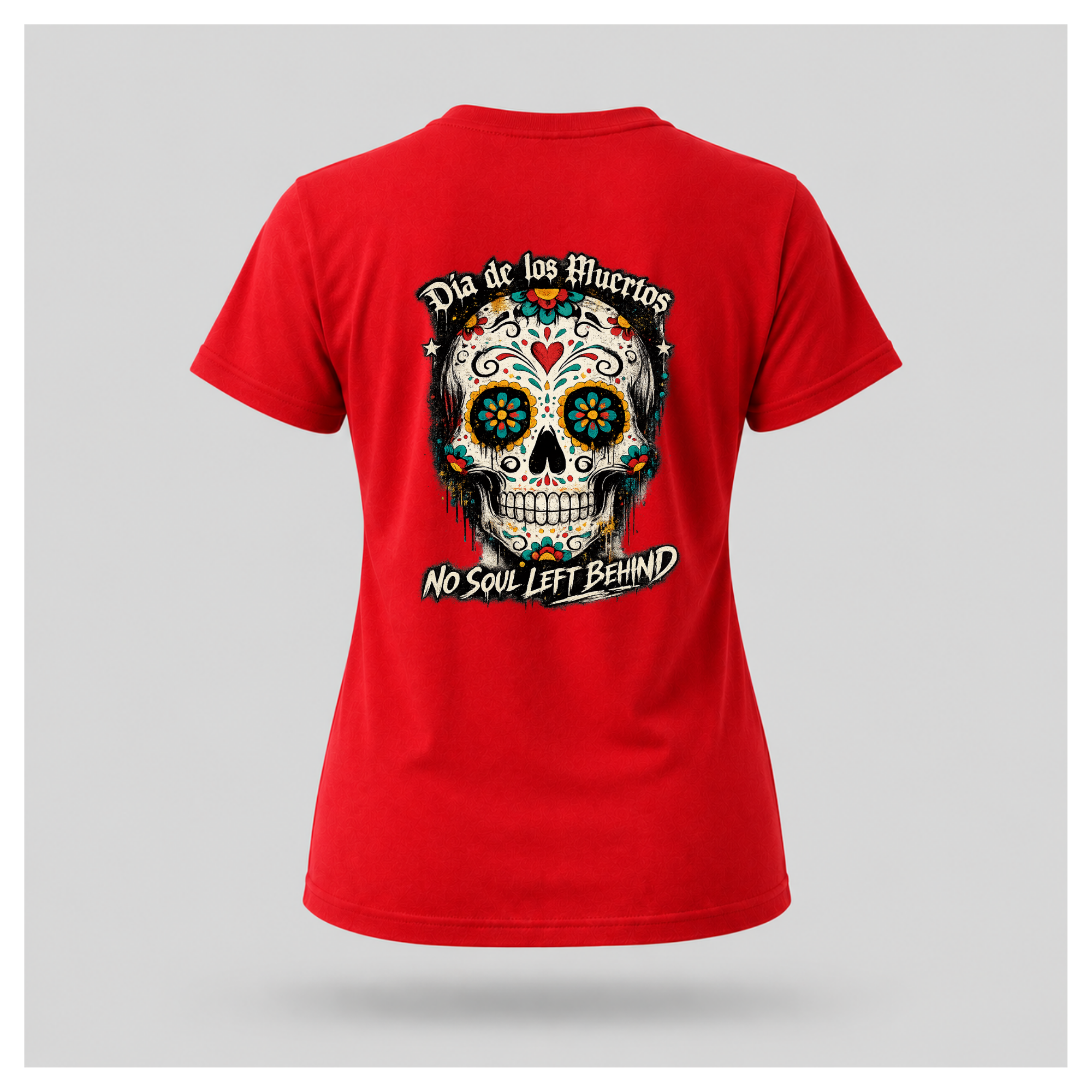 Floating women's t-shirt in red featuring a large colourful Día de los Muertos sugar skull surrounded by vibrant floral artwork, with "Día de los Muertos" above and "No Soul Left Behind" below, by RIOTTEES.