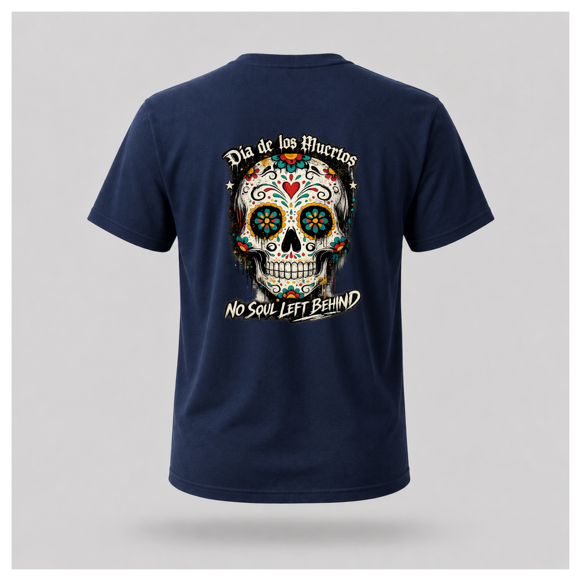 Floating men's t-shirt in navy blue featuring a large colourful Día de los Muertos sugar skull surrounded by vibrant floral artwork, with "Día de los Muertos" above and "No Soul Left Behind" below, by RIOTTEES.