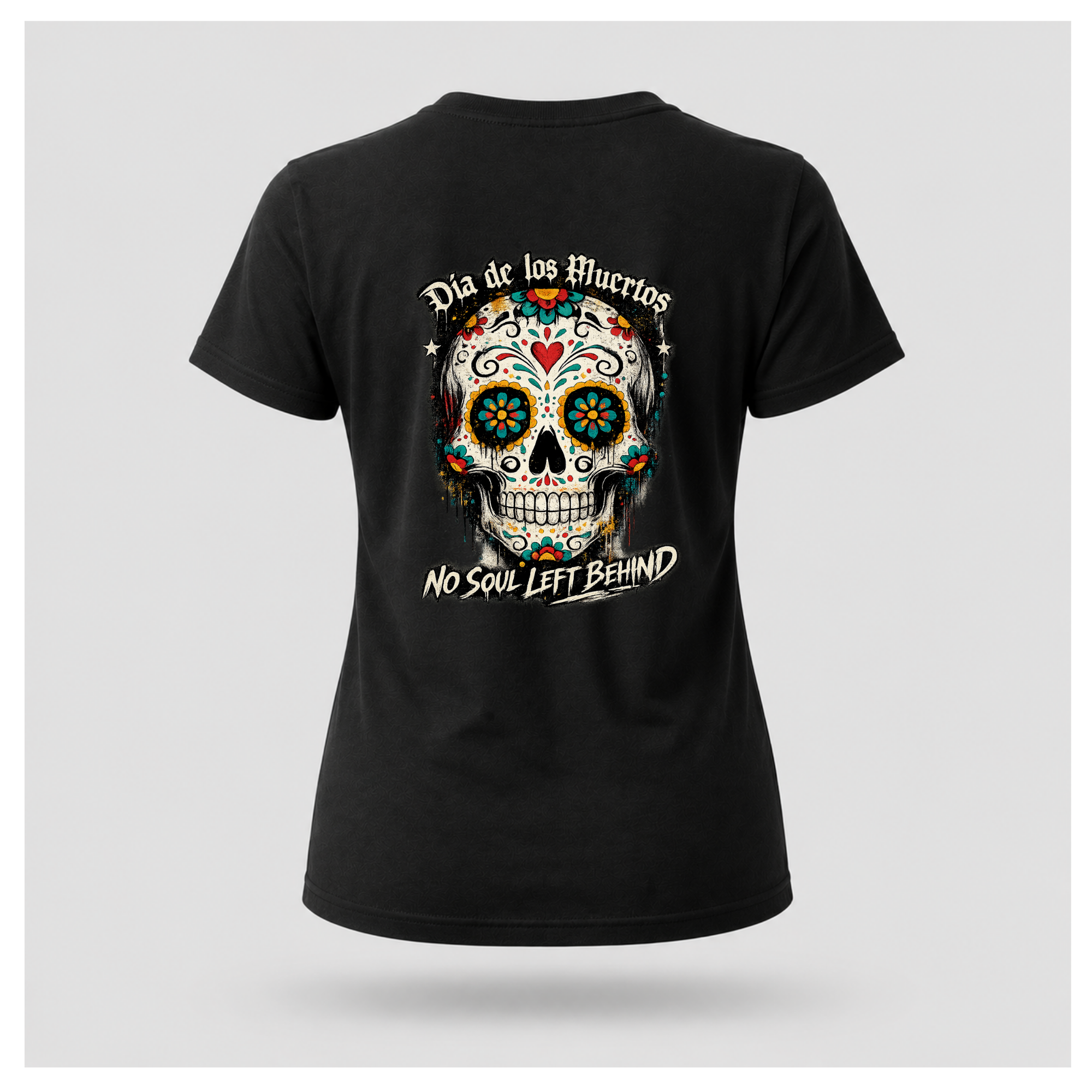 Floating women's t-shirt in black featuring a large colourful Día de los Muertos sugar skull surrounded by vibrant floral artwork, with "Día de los Muertos" above and "No Soul Left Behind" below, by RIOTTEES.