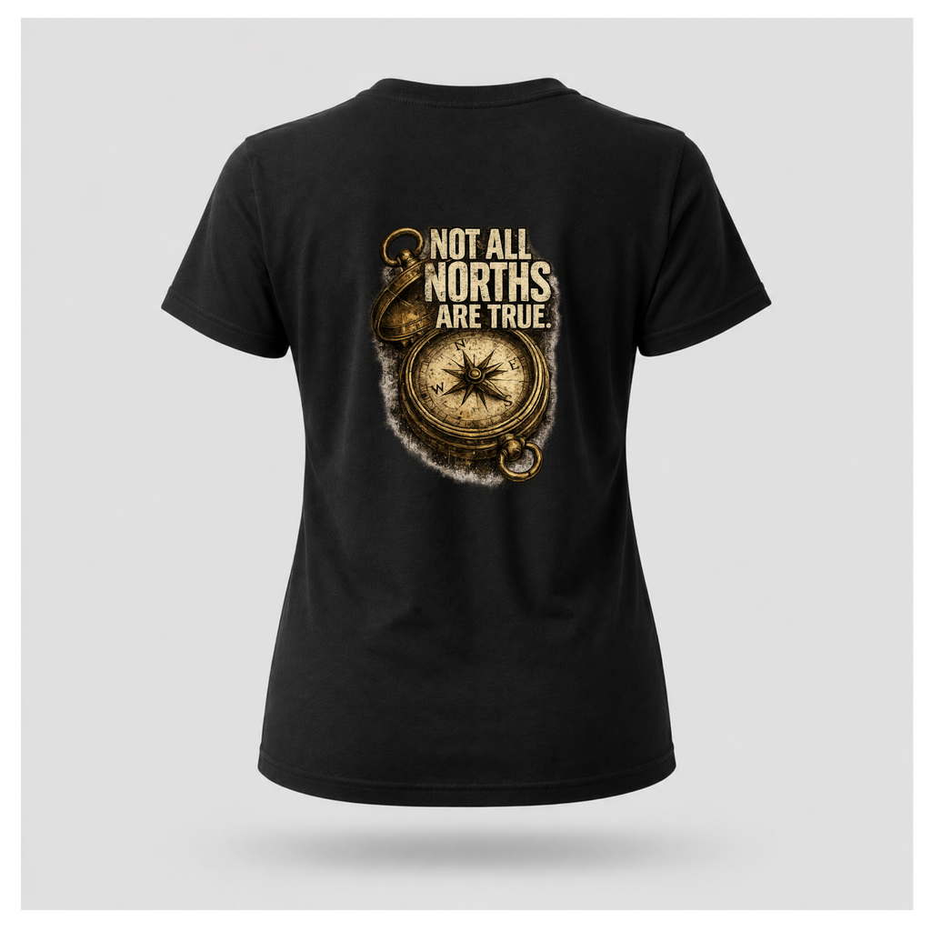 Floating female form wearing the back of the Not All Norths Are True T-shirt in Black, featuring distressed "NOT ALL NORTHS ARE TRUE" text over a vintage compass graphic by RIOTTEES.