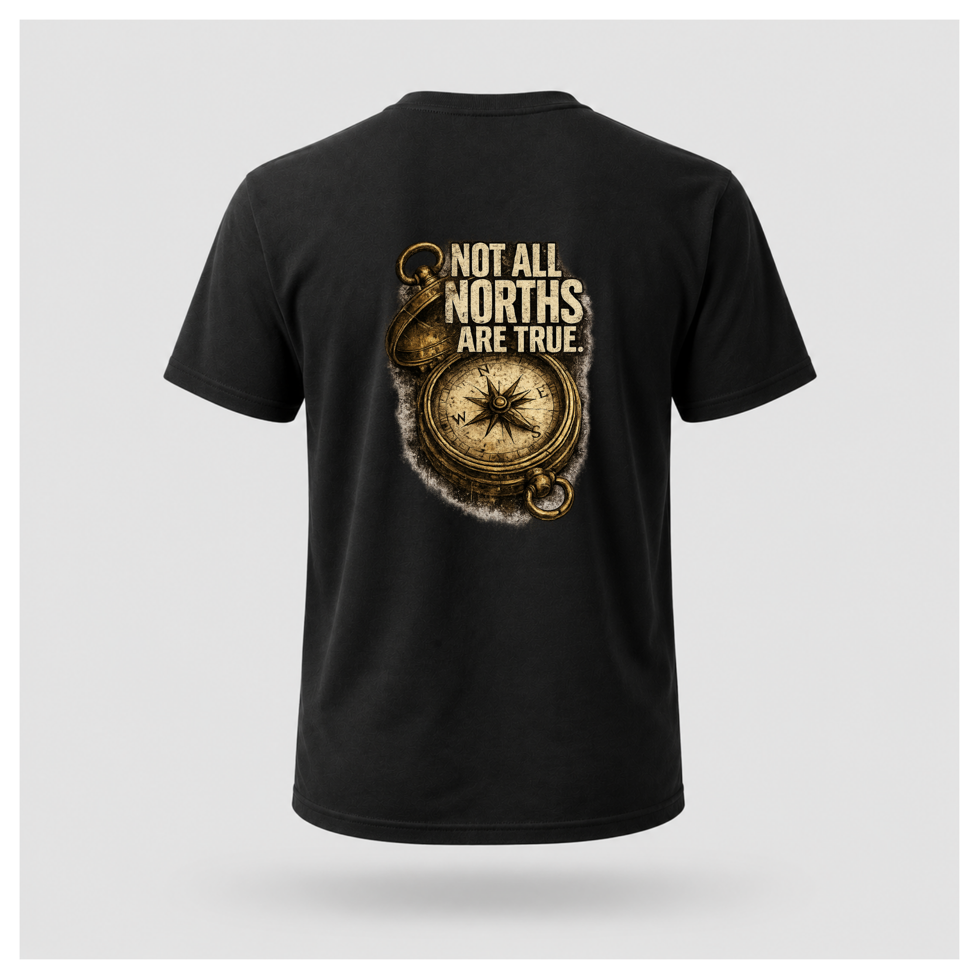 Floating male form wearing the back of the Not All Norths Are True T-shirt in Black, featuring distressed "NOT ALL NORTHS ARE TRUE" text over a vintage compass graphic by RIOTTEES.