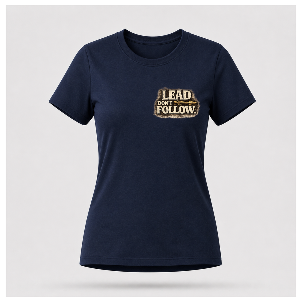 Floating female form wearing the front of the Not All Norths Are True T-shirt in Navy Blue, featuring distressed "LEAD DON'T FOLLOW" typography with a vintage arrow by RIOTTEES.