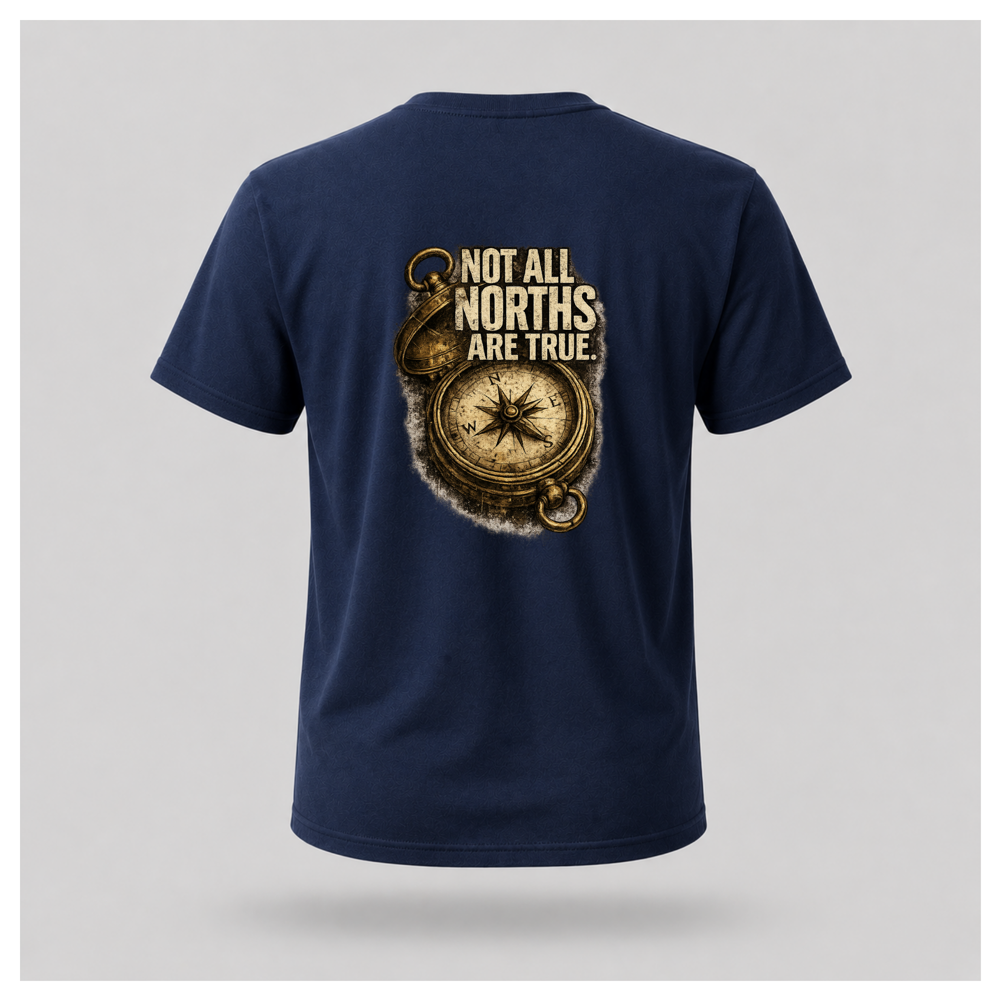 Floating male form wearing the back of the Not All Norths Are True T-shirt in Navy Blue, featuring distressed "NOT ALL NORTHS ARE TRUE" text over a vintage compass graphic by RIOTTEES.