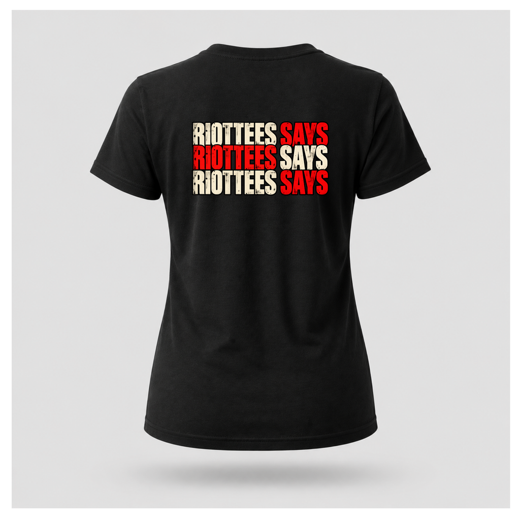 Women's black RIOTTEES T-shirt featuring repeated RIOTTEES SAYS typography across the upper back in distressed red and off-white.