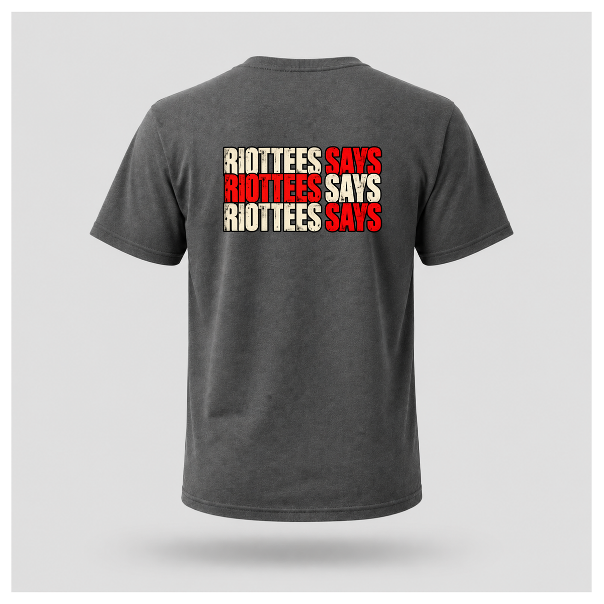 Men's charcoal grey RIOTTEES T-shirt featuring three rows of distressed RIOTTEES SAYS typography in alternating red and off-white.