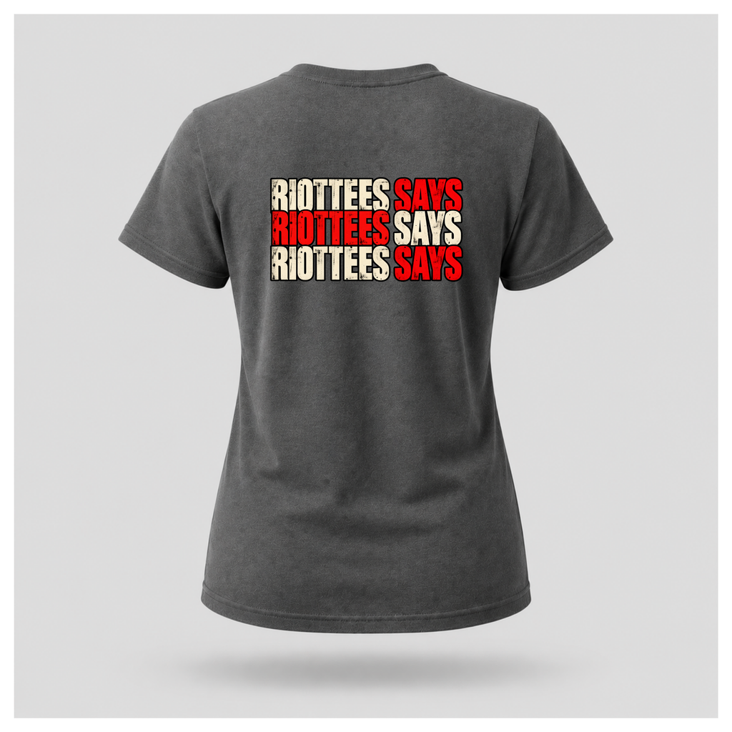 Women's charcoal grey RIOTTEES T-shirt featuring the repeated RIOTTEES SAYS back design in distressed red and off-white lettering.