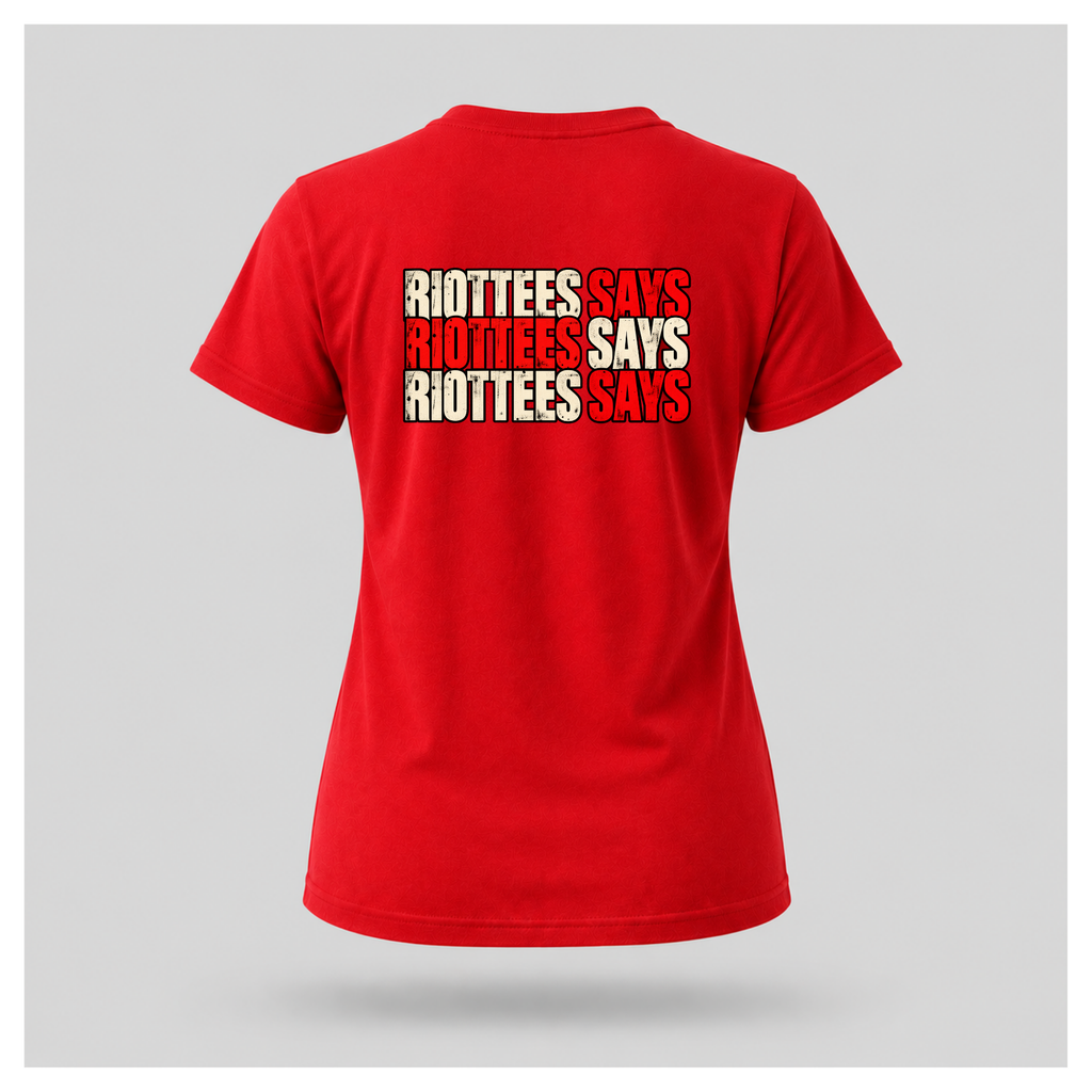 Women's red RIOTTEES tee featuring repeated RIOTTEES SAYS typography across the upper back in distressed red and off-white lettering.