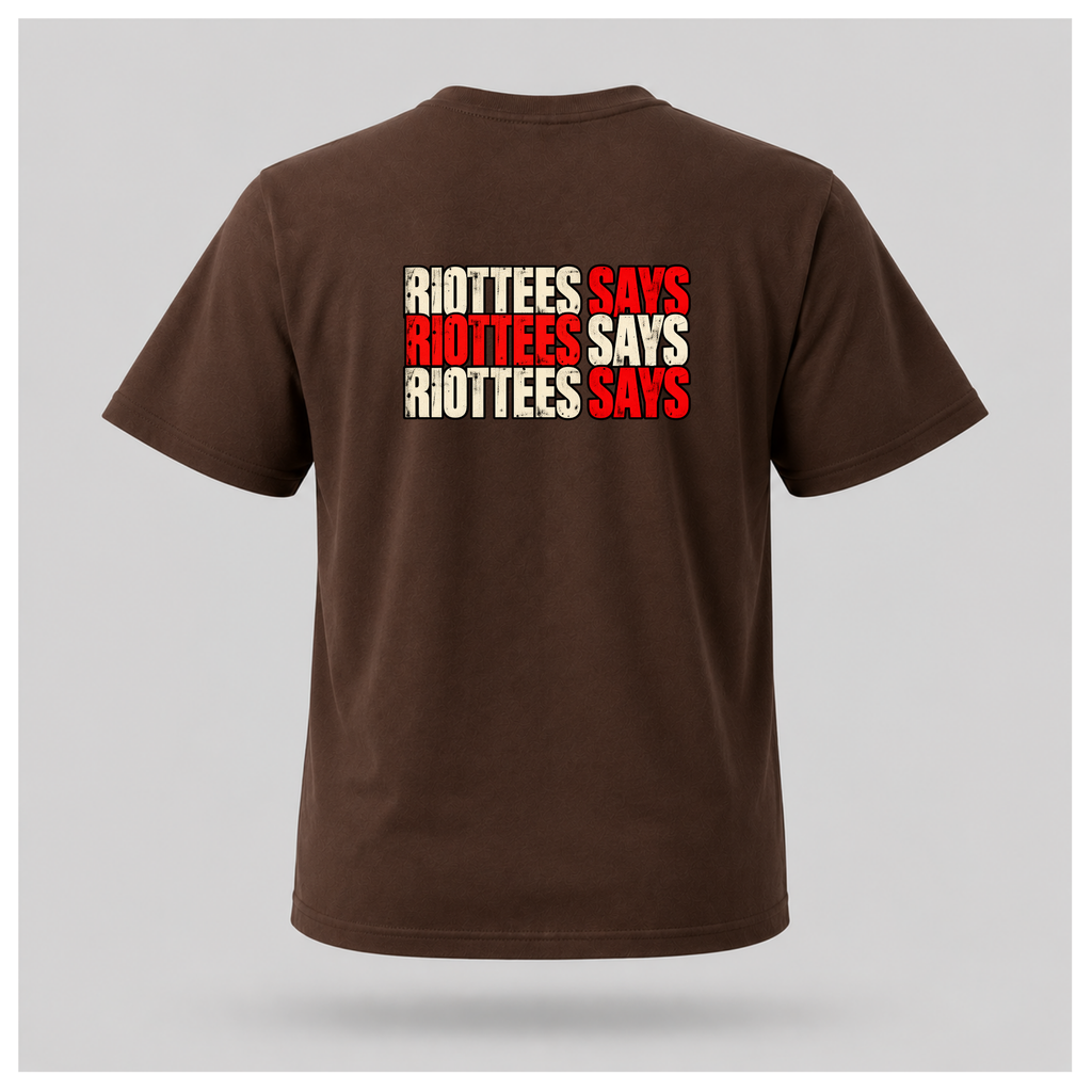 Men's chocolate brown RIOTTEES T-shirt featuring a distressed three-line RIOTTEES SAYS design in red and off-white across the upper back.