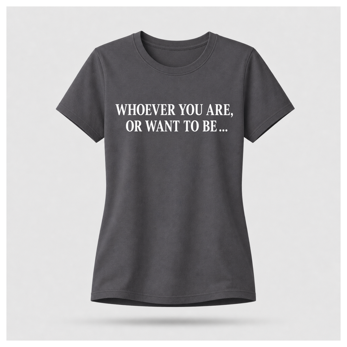 Female model wearing a charcoal grey Politics Is Interested In You T-shirt with “Whoever you are, or want to be...” printed in distressed white text on the front.