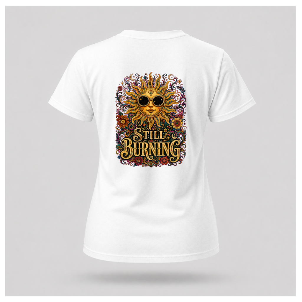 Back of a floating female form wearing the White Still Burning Sun Spirit Tee featuring an ornate celestial sun with floral artwork and the words "Still Burning" by RIOTTEES.