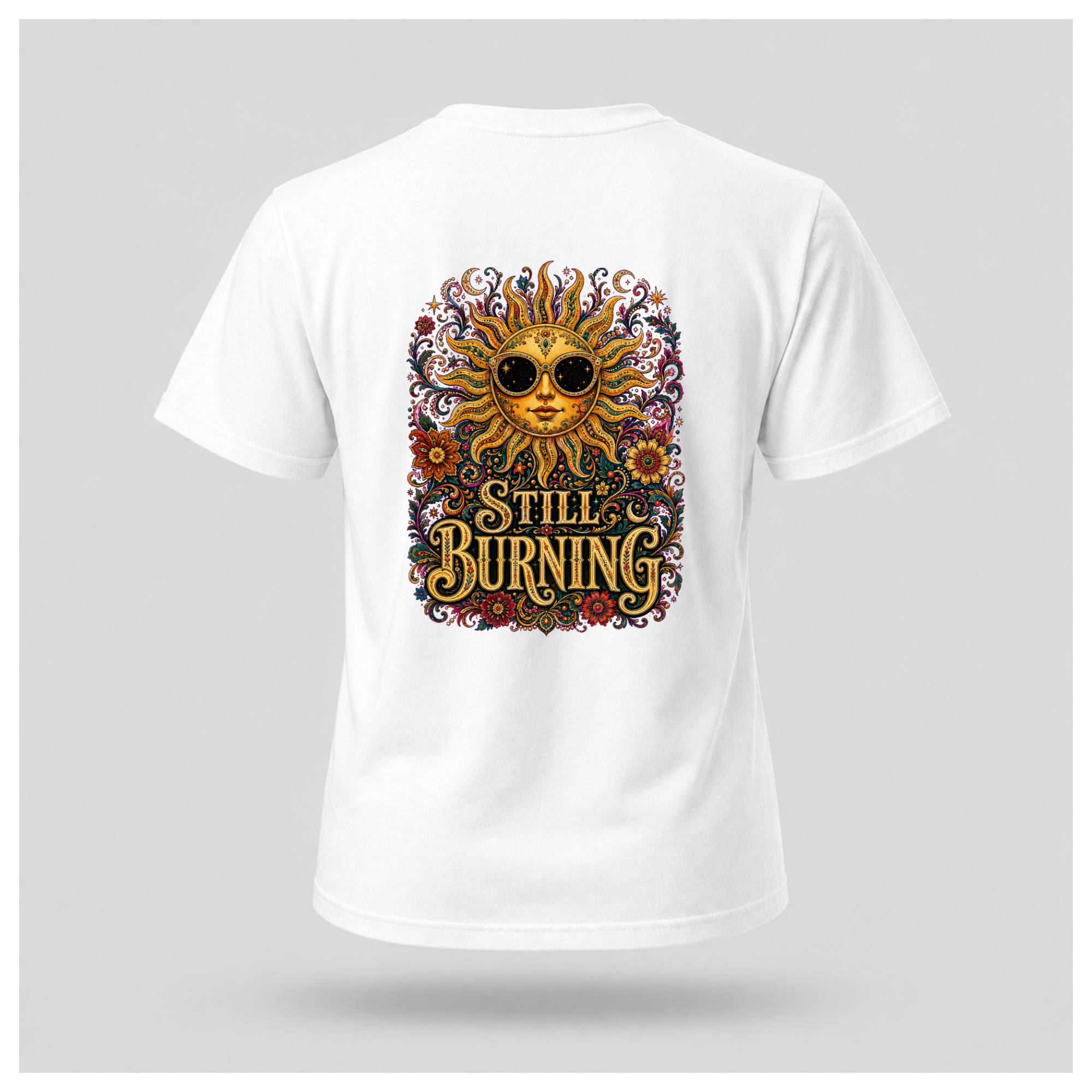 Back of a floating male form wearing the White Still Burning Sun Spirit Tee featuring an ornate celestial sun with floral artwork and the words "Still Burning" by RIOTTEES.