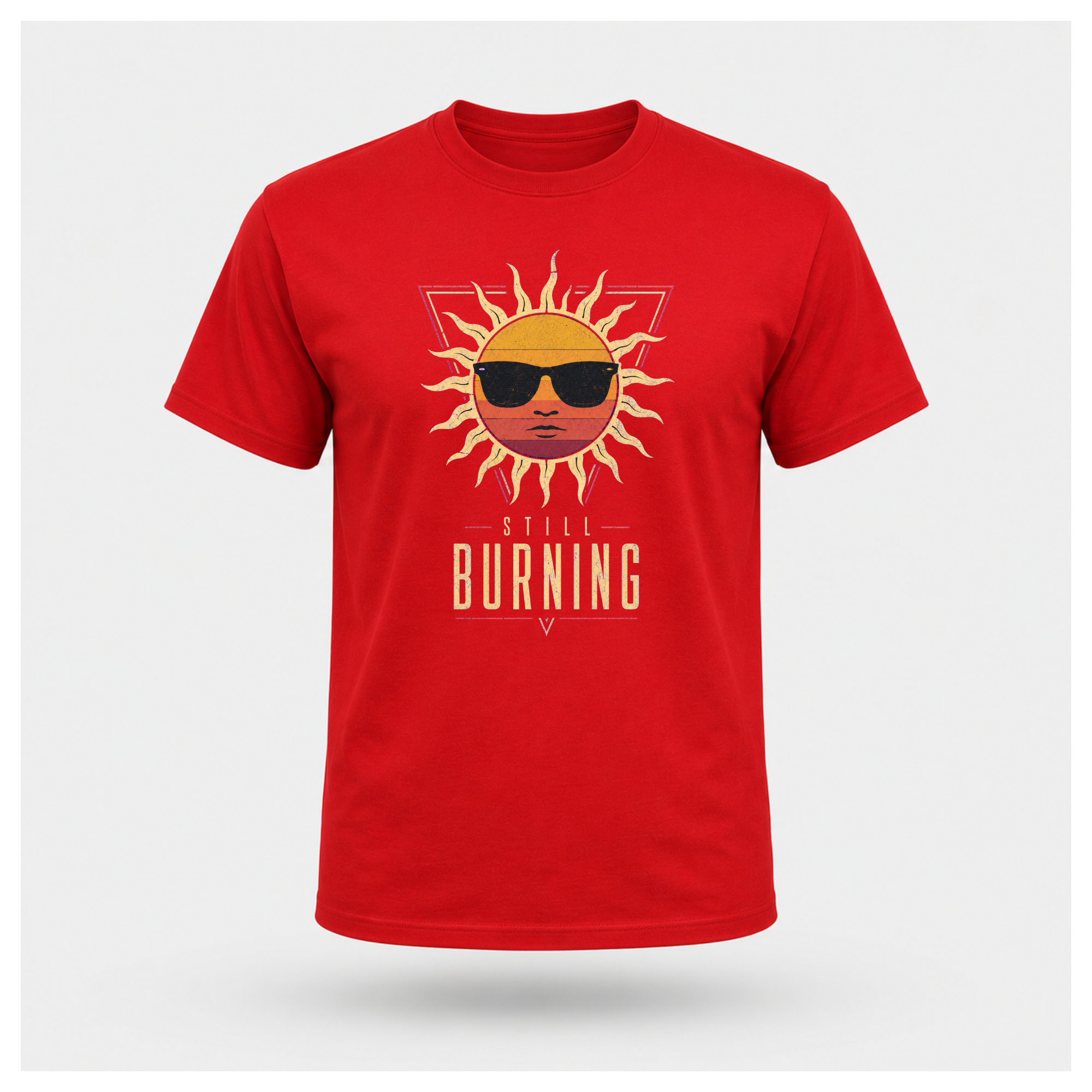Floating male form wearing the Red Still Burning Sunset Prism Gildan 5000 T-shirt featuring the vintage sunset face wearing sunglasses graphic with Still Burning typography by RIOTTEES.
