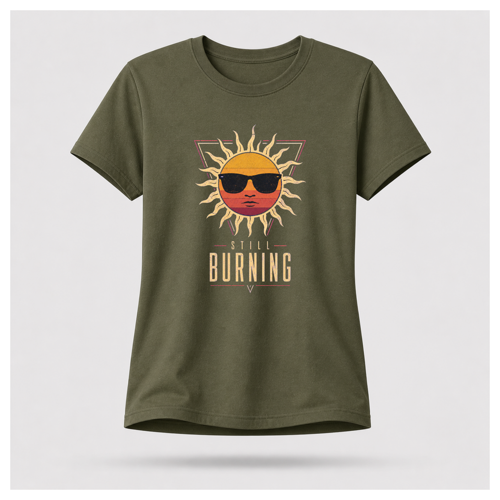 Floating female form wearing the Military Green Still Burning Sunset Prism Gildan 5000 T-shirt featuring the vintage sunset face wearing sunglasses graphic with Still Burning typography by RIOTTEES.
