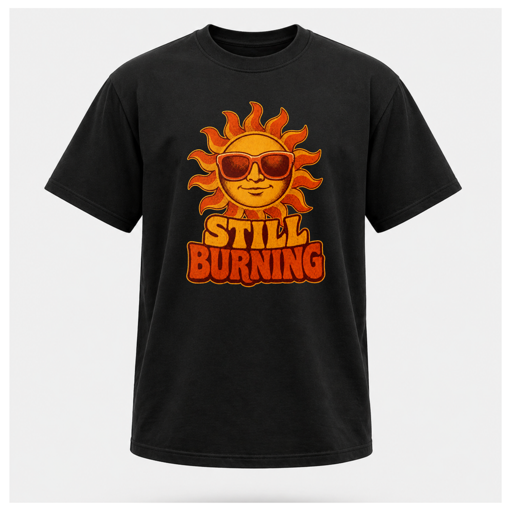 Black Still Burning Vintage Tee shown from the front on a floating male form with the Still Burning vintage sun artwork clearly visible, by RIOTTEES.