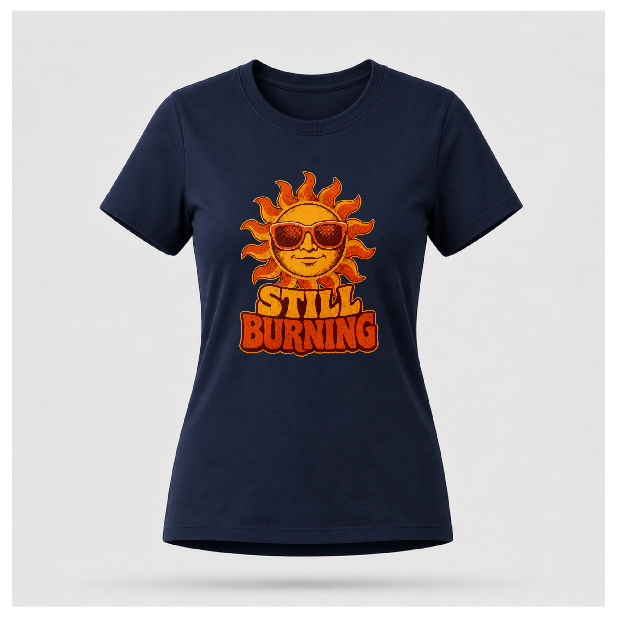 Navy Blue Still Burning Vintage Tee shown from the front on a floating female form with the Still Burning vintage sun artwork clearly visible, by RIOTTEES.