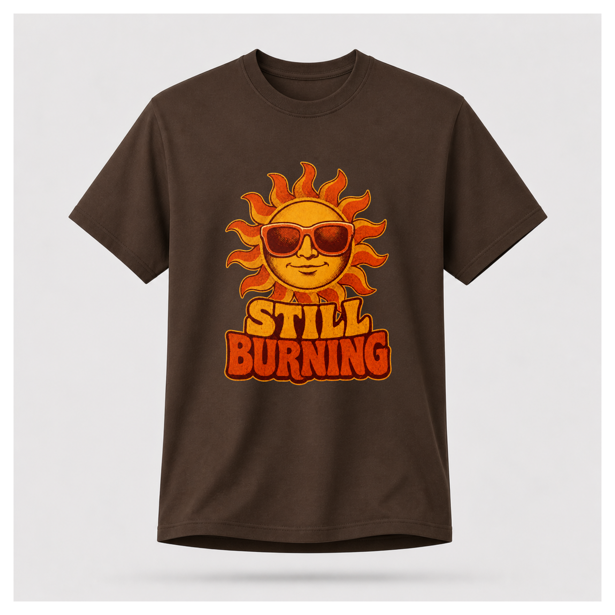 Chocolate Brown Still Burning Vintage Tee shown from the front on a floating male form with the Still Burning vintage sun artwork clearly visible, by RIOTTEES.