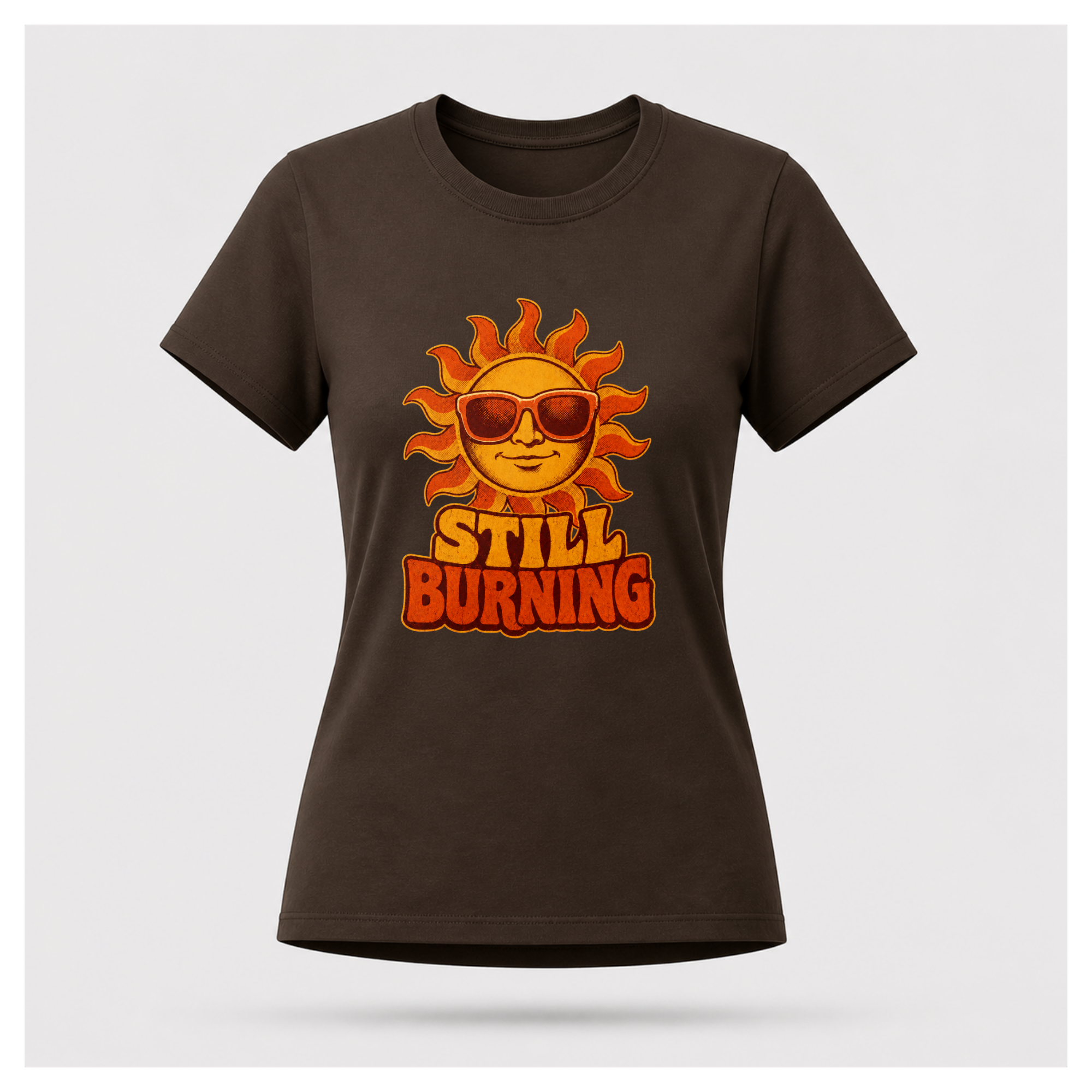 Chocolate Brown Still Burning Vintage Tee shown from the front on a floating female form with the Still Burning vintage sun artwork clearly visible, by RIOTTEES.