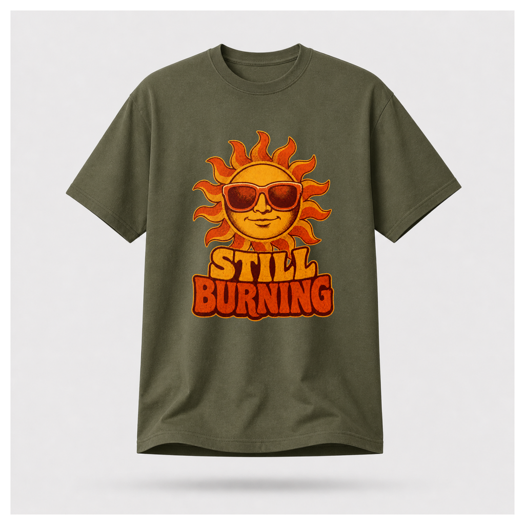 Military Green Still Burning Vintage Tee shown from the front on a floating male form with the Still Burning vintage sun artwork clearly visible, by RIOTTEES.