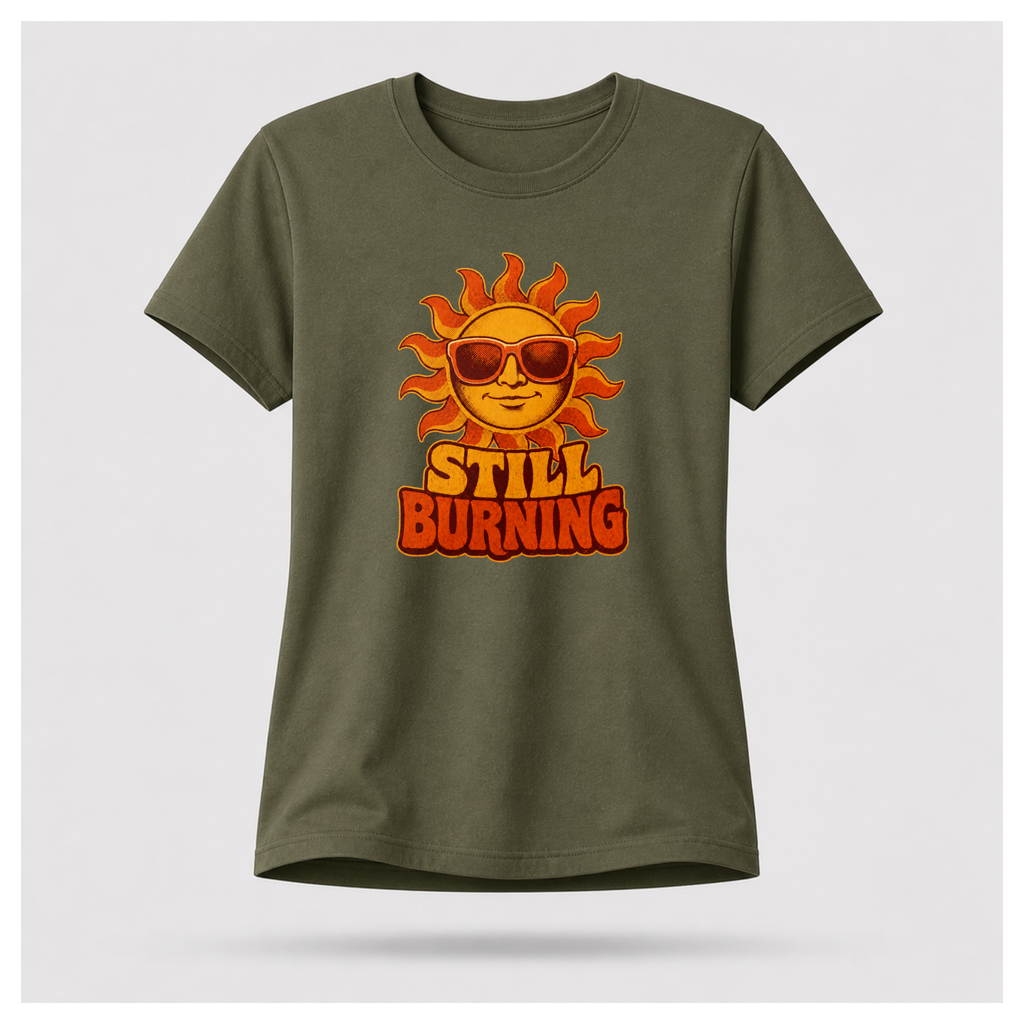 Military Green Still Burning Vintage Tee shown from the front on a floating female form with the Still Burning vintage sun artwork clearly visible, by RIOTTEES.