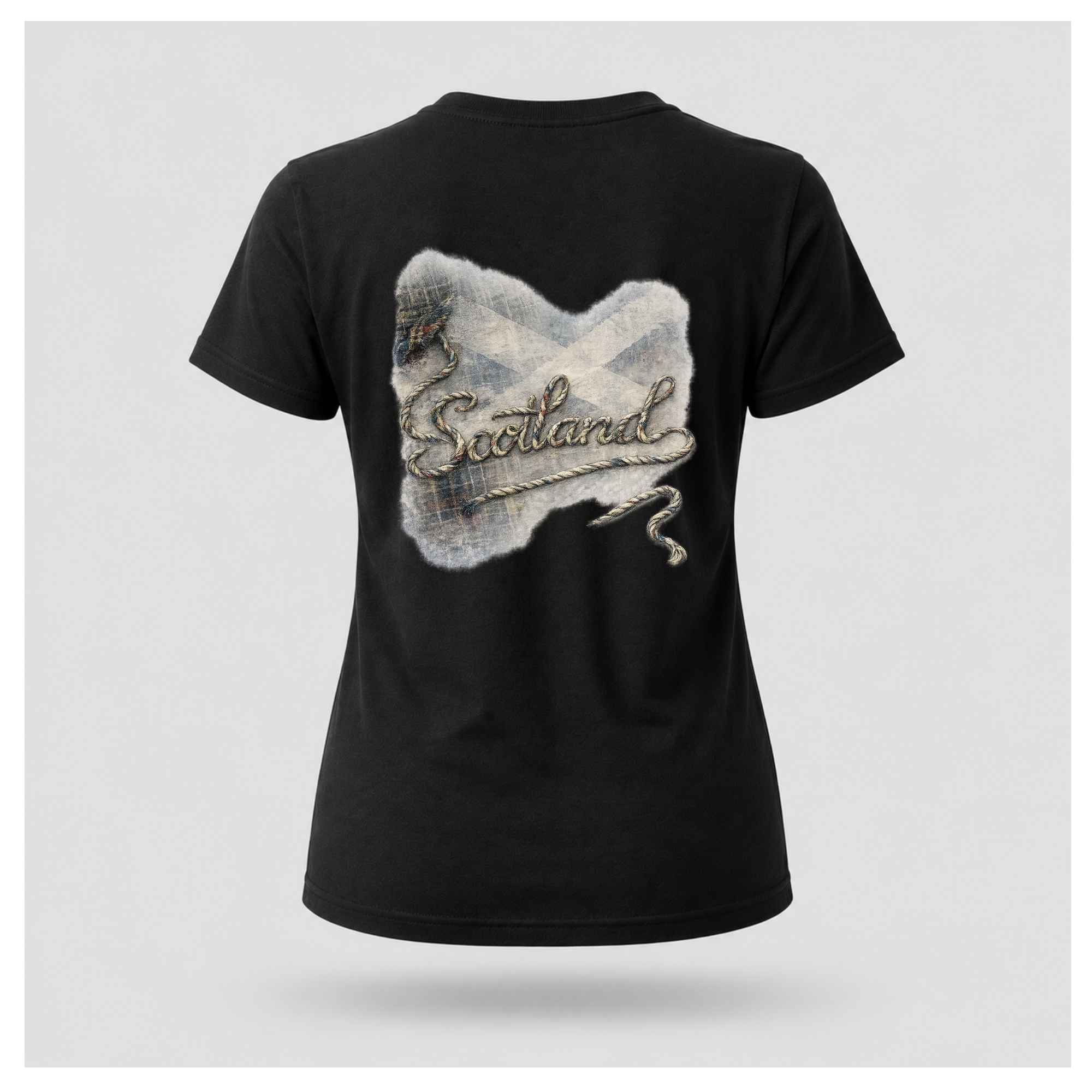 Female Back
Black Scottish Yarn t-shirt floating above a Scottish loch, displaying the women's back artwork celebrating Scotland and its stories by RIOTTEES