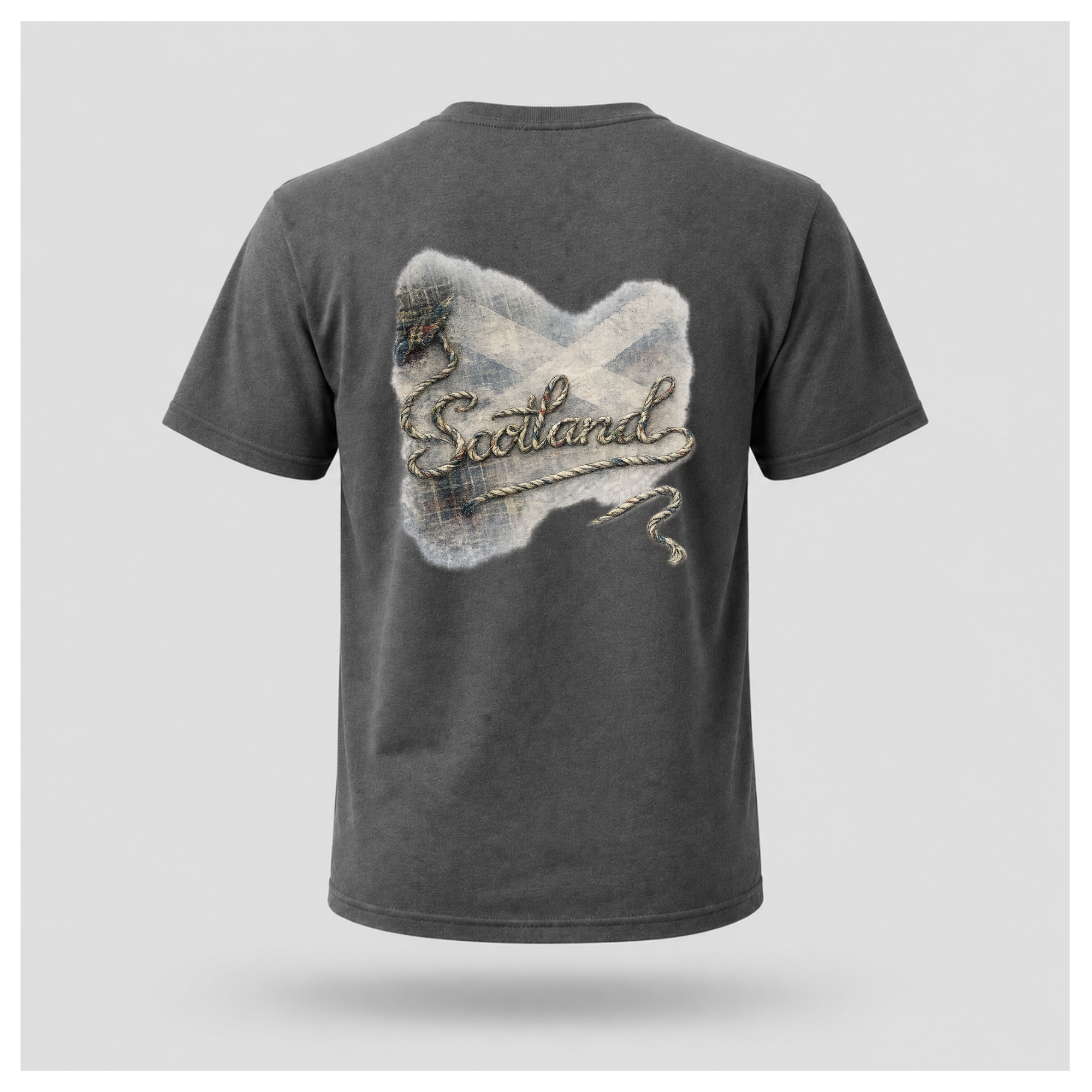 Male Back
Charcoal grey Scottish Yarn t-shirt floating above a peaceful Scottish loch, featuring the back design with tartan, Saltire and woven Scotland artwork by RIOTTEES