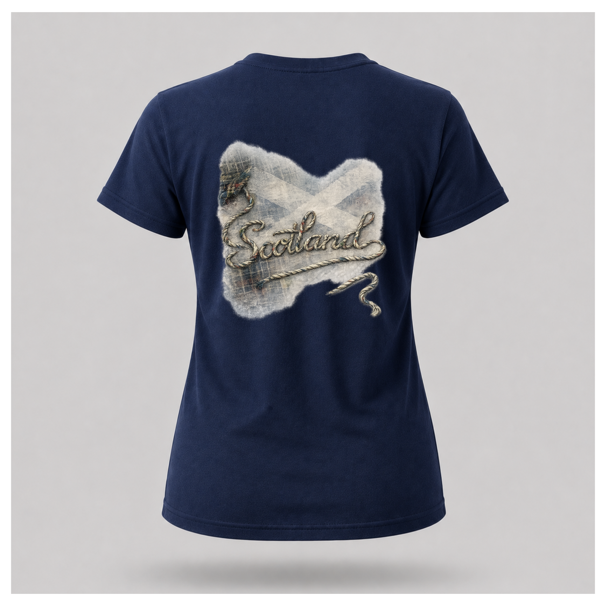 Female Back
Navy blue Scottish Yarn t-shirt floating over a calm Highland loch, showcasing the women's back design inspired by Scotland's storytelling tradition by RIOTTEES.