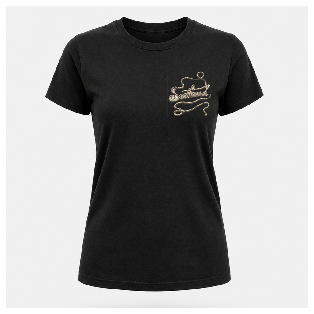 Female Front
Black Scottish Yarn t-shirt floating above a calm Scottish loch, displaying the women's subtle front design celebrating Scottish storytelling by RIOTTEES.