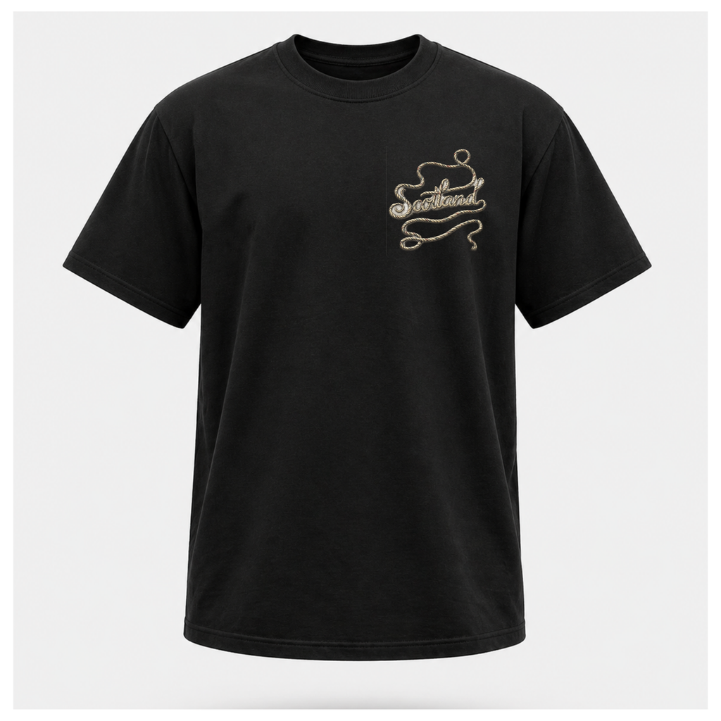 Male Front
Black Scottish Yarn t-shirt floating above a peaceful Scottish loch, displaying the subtle front design celebrating Scotland and its stories by RIOTTEES.