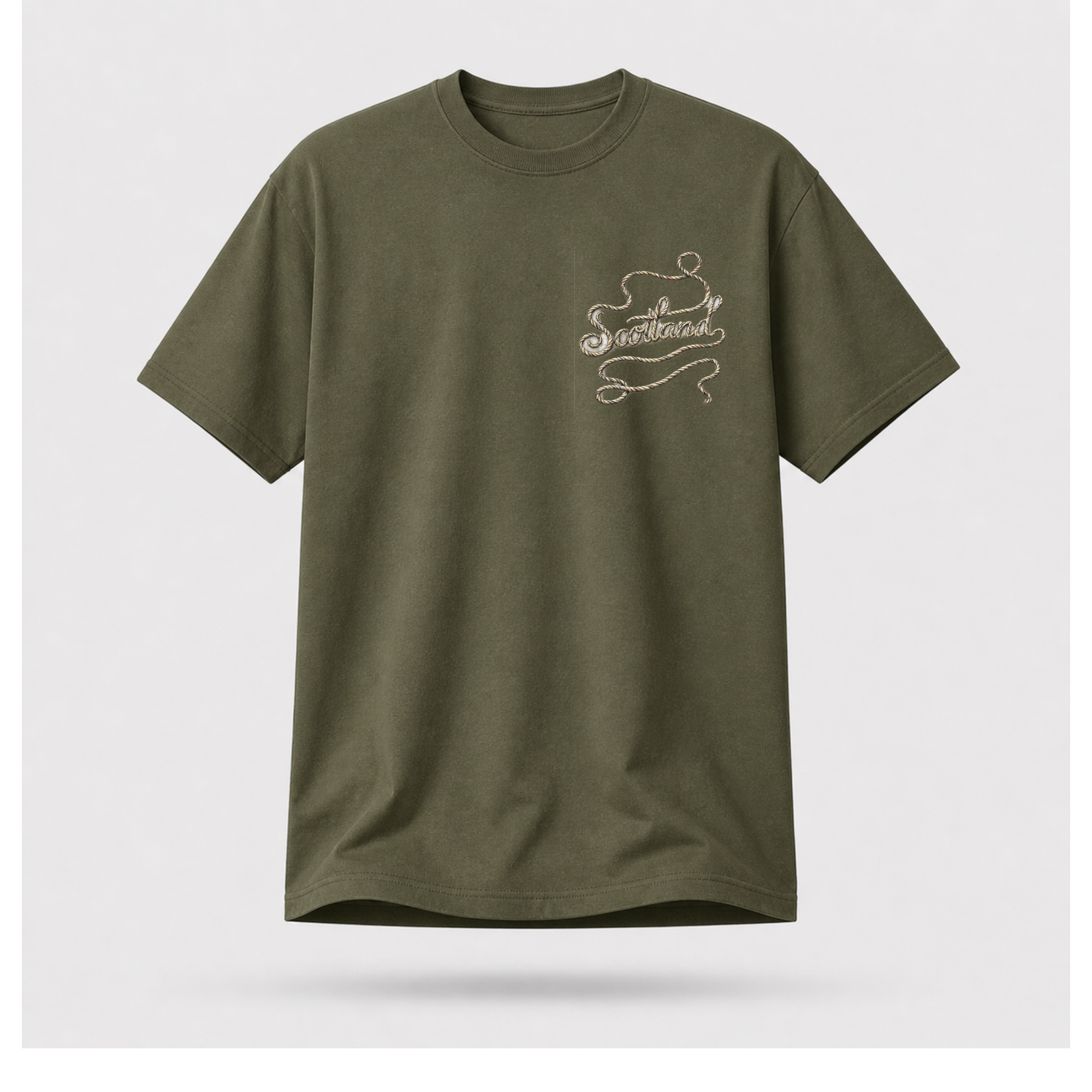 Male Front
Military green Scottish Yarn t-shirt floating above a serene Highland loch, showcasing the minimalist front artwork by RIOTTEES.