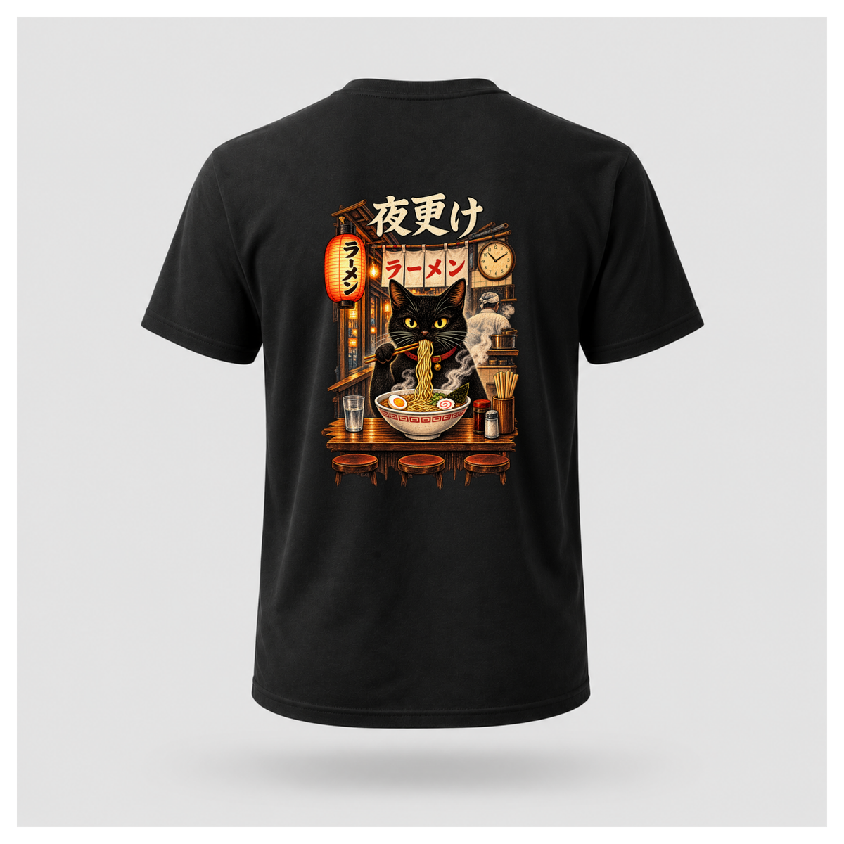Male floating form wearing a black Yofuke Ramen Cat graphic T-shirt, showing the large Japanese-inspired ramen cat back design by RIOTTEES.